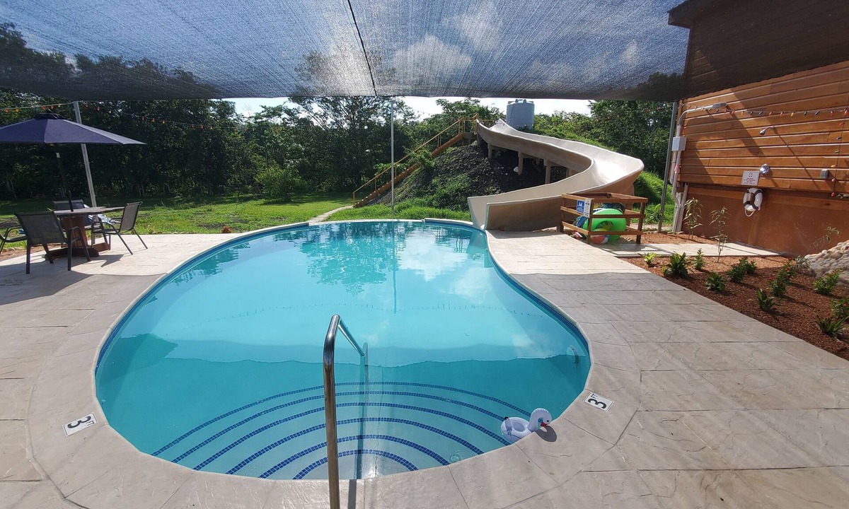 San Ignacio House | A stunning private estate situated on 6.5 acres along the Mopan River with pool and water slide.