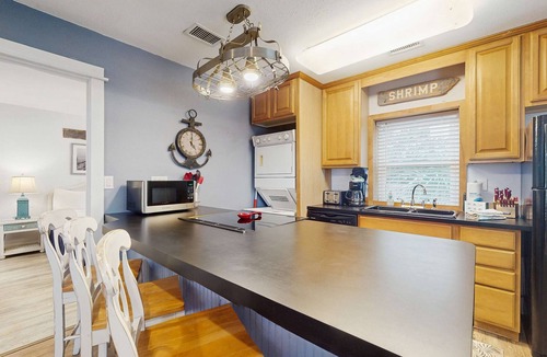 St. George Island Condo | Cozy coastal condo with shared pool, washer/dryer,and beach access