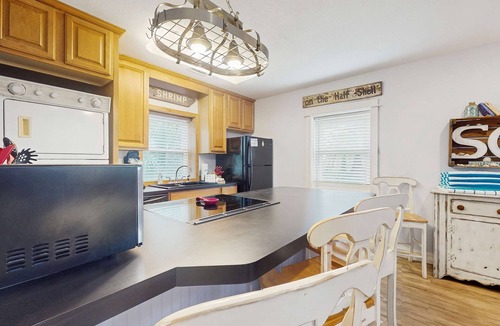 St. George Island Condo | Cozy coastal condo with shared pool, washer/dryer,and beach access