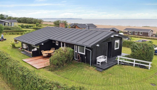 Lovely summerhouse by Skaastrup Strand w sea view in Bogense