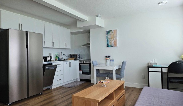 Private south-facing suite with a full bathroom and fully equipped kitchen. in Coquitlam