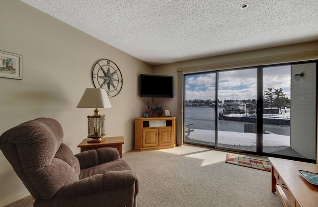 Edgewater Inn 115 | Sunrise Over Lake Charlevoix | Pool, Hot Tub, Sauna in Charlevoix