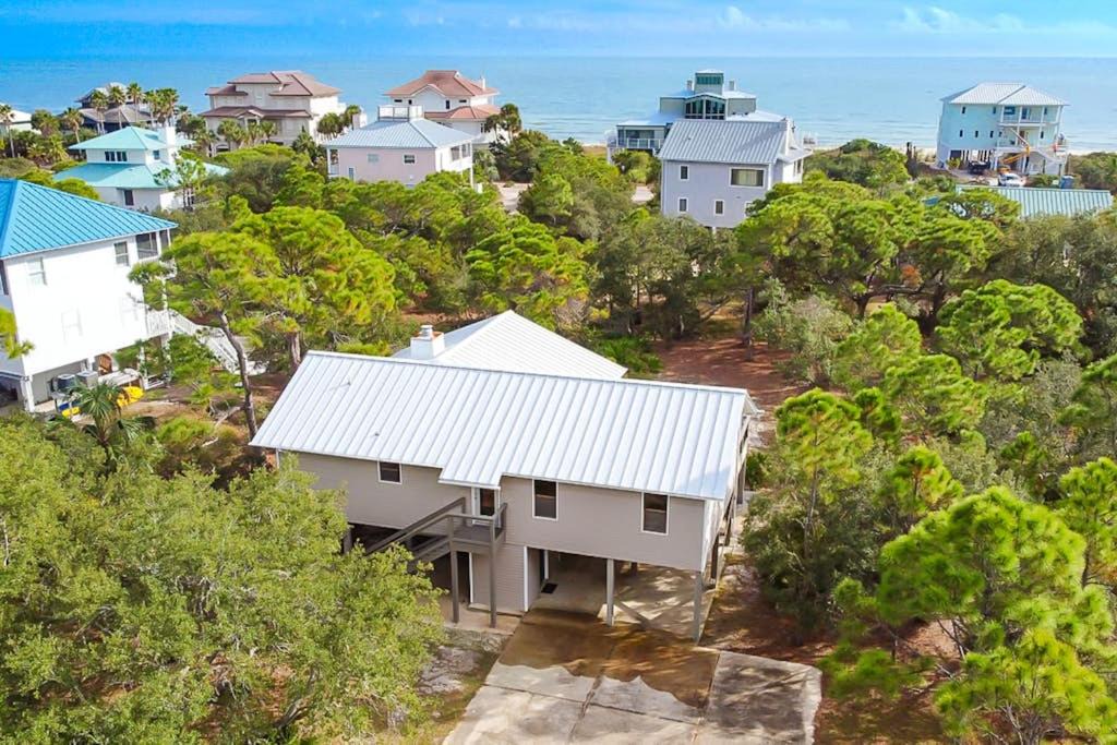 Plantation House | Charming cottage walk to Gulf with shared pools hot tub & central AC