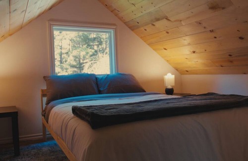 Woodland House | Escape to this peaceful, dog-friendly woodland retreat near the Lewis River. Enjoy a beautifully updated kitchen, cozy living spaces, and a spacious deck overlooking nature. With a fire pit and quiet surroundings, it’s perfect for a relaxing getaway.