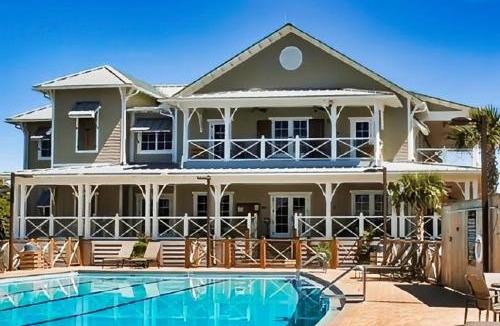 Plantation House | Charming cottage walk to Gulf with shared pools hot tub & central AC